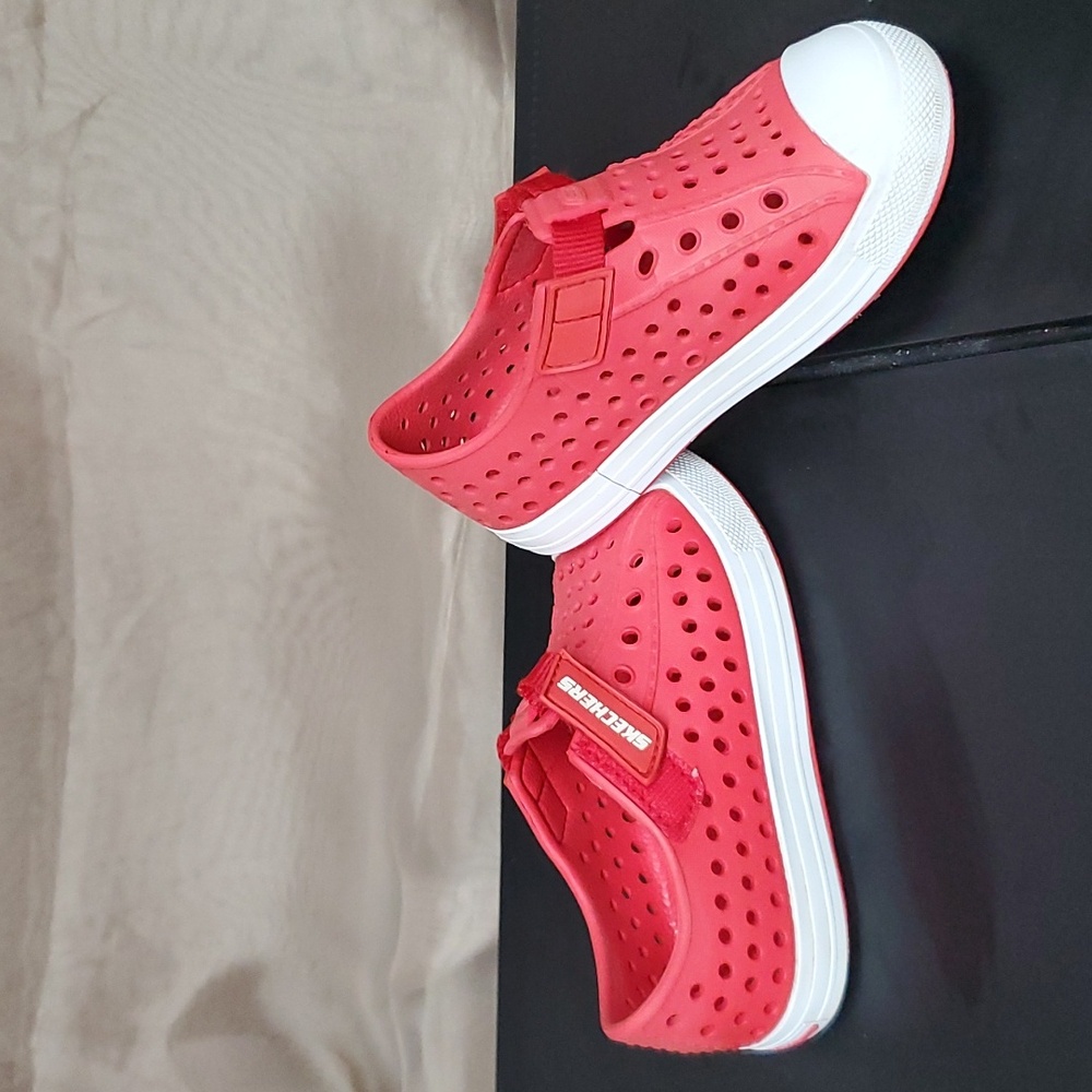 Skechers, red slip-ons with velcro for easy on. Size 9.